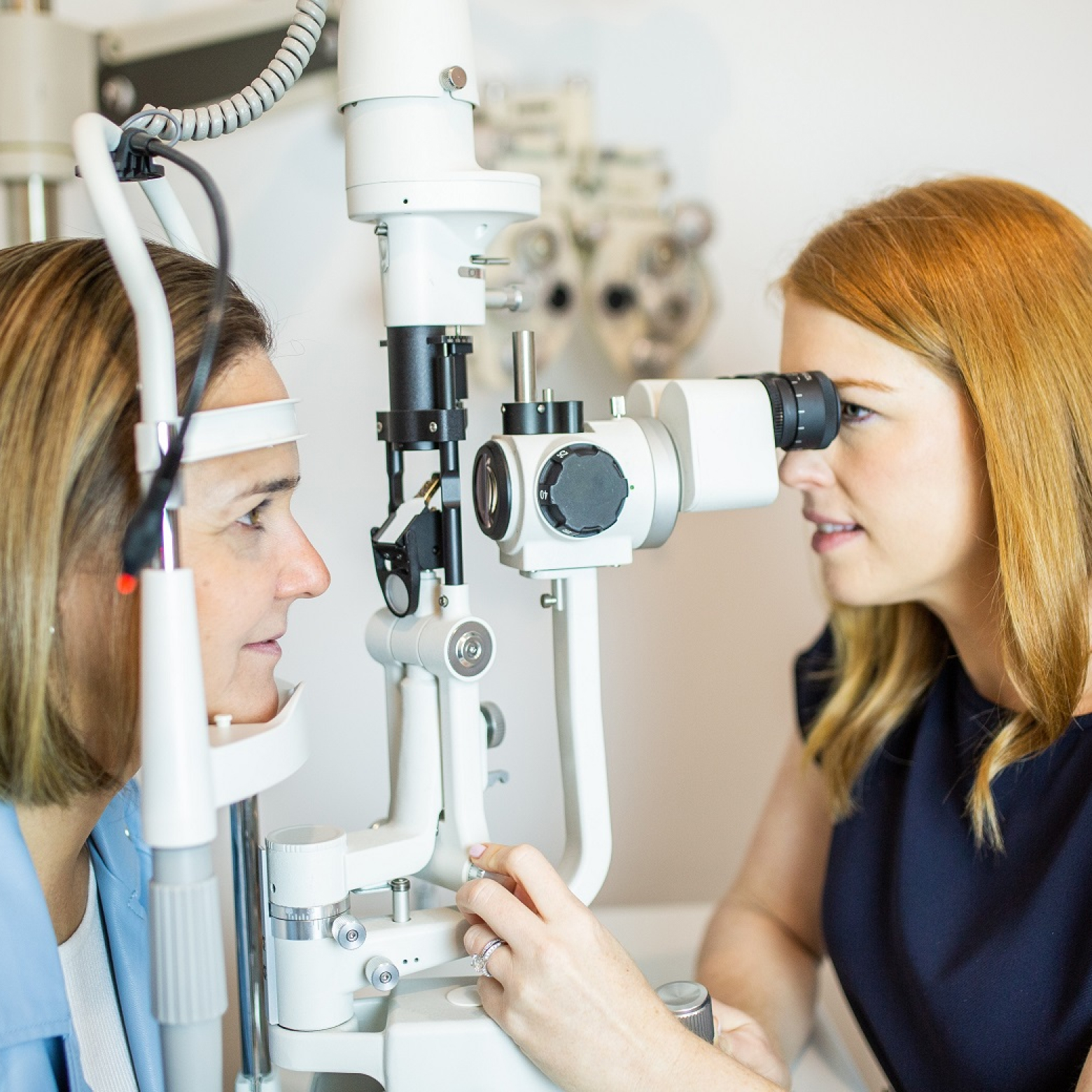 Temple Eyewear employee conducting eye test